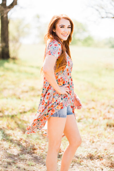 model with long red hair wearing crazy train hi low top in a wooded scene