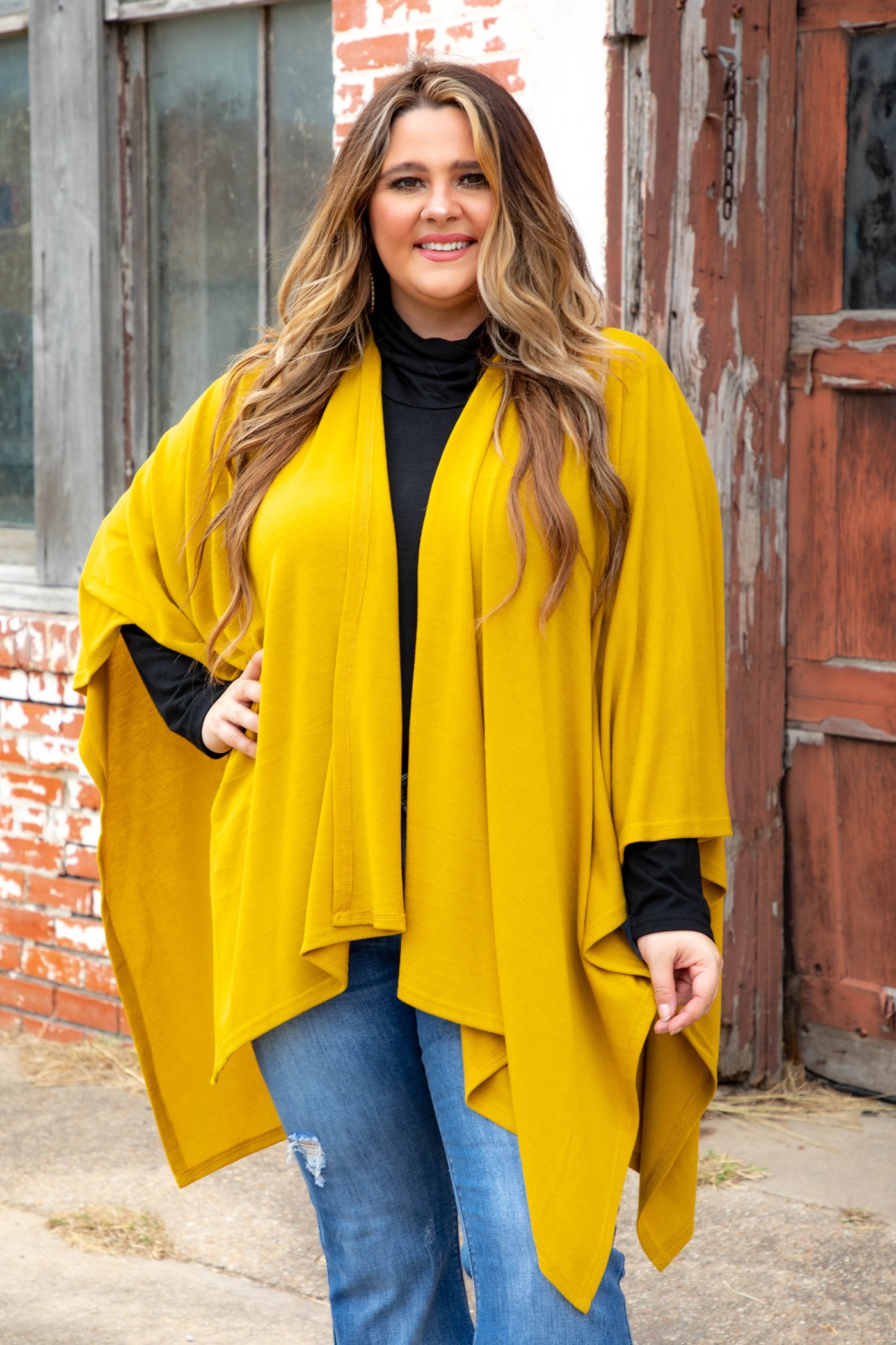 model wearing mustard colored L&B shawl